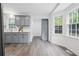 Bright kitchen with ample counter space, gray cabinets, modern appliances, and lots of natural light at 2724 Bomar Rd, Douglasville, GA 30135