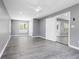 Spacious room with gray walls, a ceiling fan and wood-look flooring at 2724 Bomar Rd, Douglasville, GA 30135