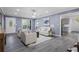 Cozy living room with gray walls, lots of natural light, a fireplace, and smooth flow into the kitchen and dining areas at 2724 Bomar Rd, Douglasville, GA 30135