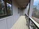Wide balcony with metal railing and room for outdoor seating, offering a serene view at 455 Firefly Cir # 39, Alpharetta, GA 30009