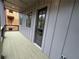 Spacious outdoor balcony with gray siding and metal railing at 455 Firefly Cir # 39, Alpharetta, GA 30009