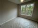Cozy bedroom featuring a ceiling fan and a pair of windows offering natural light and views at 455 Firefly Cir # 39, Alpharetta, GA 30009