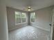 Bright bedroom with a ceiling fan, carpet, and two large windows at 455 Firefly Cir # 39, Alpharetta, GA 30009