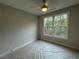 Bright bedroom with a ceiling fan and large windows offering beautiful outdoor views at 455 Firefly Cir # 39, Alpharetta, GA 30009