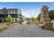 Charming community with modern architecture, mature trees, and a stone monument at 455 Firefly Cir # 39, Alpharetta, GA 30009