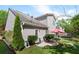 Backyard with patio, grill, red umbrella, green trees, and lawn at 207 Cole Ct, Canton, GA 30114