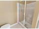 Tiled stand up shower features glass door and neutral color scheme at 207 Cole Ct, Canton, GA 30114
