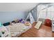Bedroom with natural light, decorative tent, and hardwood flooring at 207 Cole Ct, Canton, GA 30114