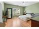Inviting bedroom with a ceiling fan, a window, and a comfortable bed, perfect for relaxation at 207 Cole Ct, Canton, GA 30114
