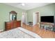 Spacious bedroom with an inviting bed, a dresser, and a view of the room's interior at 207 Cole Ct, Canton, GA 30114