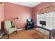 Cozy bedroom with a desk and chair, creating a functional and comfortable living space at 207 Cole Ct, Canton, GA 30114