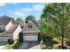 Charming front exterior of a home with a well-maintained lawn and beautiful curb appeal at 207 Cole Ct, Canton, GA 30114