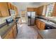 Traditional kitchen featuring stainless steel appliances, wood cabinets, and access to the backyard at 207 Cole Ct, Canton, GA 30114