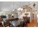 Inviting living room features vaulted ceilings, hardwood floors, and staircase at 207 Cole Ct, Canton, GA 30114