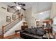 Inviting living room features vaulted ceilings, hardwood floors, and staircase at 207 Cole Ct, Canton, GA 30114