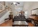 Inviting living room features vaulted ceilings, hardwood floors, and staircase at 207 Cole Ct, Canton, GA 30114
