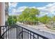 Balcony overlooking a street and intersection with lush green trees in the background on a sunny day at 2277 Peachtree Ne Rd # 310, Atlanta, GA 30309
