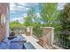 Cozy balcony with outdoor seating, planter boxes, and a view of lush greenery and street at 2277 Peachtree Ne Rd # 310, Atlanta, GA 30309