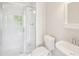 Bathroom with glass shower doors, sink and toilet at 2277 Peachtree Ne Rd # 310, Atlanta, GA 30309