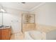 Bathroom featuring a bathtub, shower with glass door, granite countertops, and tile flooring at 2277 Peachtree Ne Rd # 310, Atlanta, GA 30309