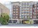 The Aramore building shows an elegant exterior with brick and stone details, balconies and covered drive-through at 2277 Peachtree Ne Rd # 310, Atlanta, GA 30309