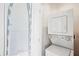 Laundry room features washer and dryer unit and built in ironing board at 2277 Peachtree Ne Rd # 310, Atlanta, GA 30309