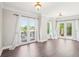 Bright living room featuring hardwood floors and French doors to a balcony at 2277 Peachtree Ne Rd # 310, Atlanta, GA 30309