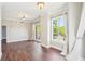 Spacious living room with hardwood floors, large windows, and balcony access at 2277 Peachtree Ne Rd # 310, Atlanta, GA 30309