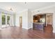 Open living area with wood floors, leads to a kitchen and French doors to balcony at 2277 Peachtree Ne Rd # 310, Atlanta, GA 30309
