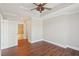 View of the main bedroom leading to the bathroom, featuring hardwood floors and natural light at 2277 Peachtree Ne Rd # 310, Atlanta, GA 30309
