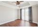 Spacious main bedroom with hardwood floors and a ceiling fan and access to a private balcony at 2277 Peachtree Ne Rd # 310, Atlanta, GA 30309