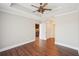 Spacious main bedroom with hardwood floors, ceiling fan, and access to a small kitchen area at 2277 Peachtree Ne Rd # 310, Atlanta, GA 30309