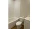 Bathroom featuring a soaking tub with white subway tile and a modern toilet at 445 Firefly Cir # 40, Alpharetta, GA 30009