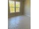 Sunlit bedroom with large windows offering a pleasant outdoor view at 445 Firefly Cir # 40, Alpharetta, GA 30009