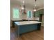 Stylish kitchen featuring an island, modern lighting, and stainless steel appliances at 445 Firefly Cir # 40, Alpharetta, GA 30009