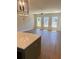 Open-concept living space with hardwood floors and modern lighting at 445 Firefly Cir # 40, Alpharetta, GA 30009