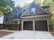 Charming two-story brick home with a two-car garage and well-maintained landscaping at 5789 Star Flower Dr, Ellenwood, GA 30294