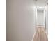 Hallway with a view of other rooms, neutral wall colors, and wood-style floors at 5789 Star Flower Dr, Ellenwood, GA 30294