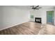 Bright living room featuring a fireplace, wood-look flooring, and natural light at 5789 Star Flower Dr, Ellenwood, GA 30294