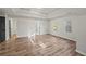 Large bedroom offers wood flooring and a walk in closet with an entry to the bathroom at 5789 Star Flower Dr, Ellenwood, GA 30294
