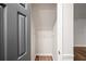 A storage area featuring white walls, wood-style flooring, and a wired shelf at 5789 Star Flower Dr, Ellenwood, GA 30294