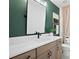 Bathroom featuring modern vanity with a white countertop and sleek fixtures, plus a large mirror at 114 Briargate Dr, Johns Creek, GA 30097