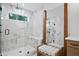 Luxurious bathroom featuring a glass shower, marble accents, and a modern double vanity at 114 Briargate Dr, Johns Creek, GA 30097