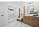 Spa-like bathroom with marble tiling, a glass-enclosed shower, and a double vanity with wood cabinetry at 114 Briargate Dr, Johns Creek, GA 30097