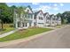 Charming exterior view of townhomes with manicured lawns and inviting curb appeal at 114 Briargate Dr, Johns Creek, GA 30097