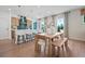 Bright kitchen with breakfast bar, stainless steel appliances, and open layout to dining area at 114 Briargate Dr, Johns Creek, GA 30097