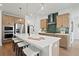 Well-equipped kitchen with a large island, stainless steel appliances, and ample counter space at 114 Briargate Dr, Johns Creek, GA 30097