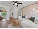 Bright and airy living room with stylish decor, an arched mirror, and lots of natural light at 114 Briargate Dr, Johns Creek, GA 30097