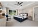 Serene main bedroom with tray ceilings, soft lighting, and a charming window-side reading nook at 114 Briargate Dr, Johns Creek, GA 30097