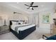 Elegant main bedroom featuring tray ceilings, neutral color scheme, and easy access to the bathroom at 114 Briargate Dr, Johns Creek, GA 30097